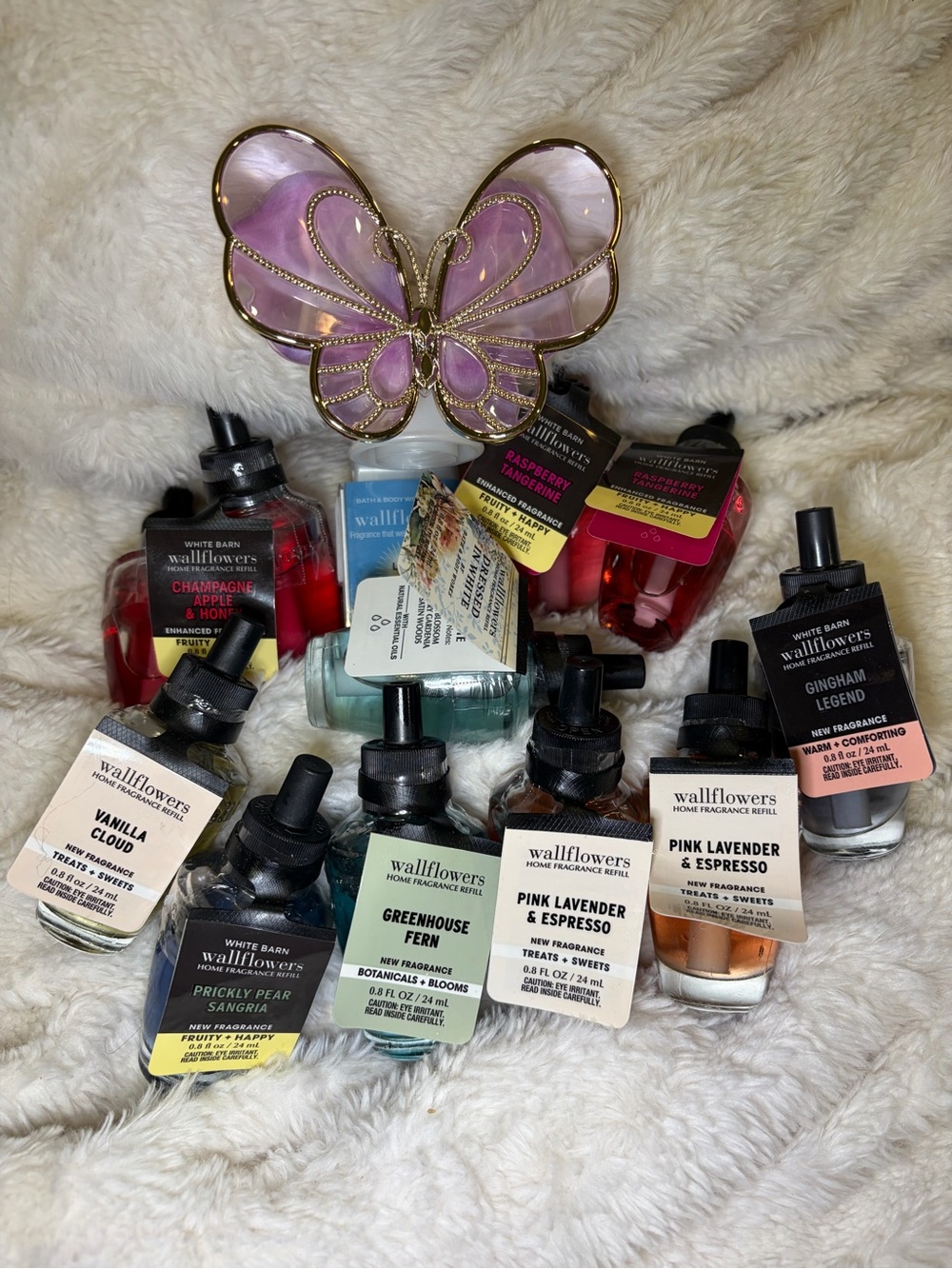 Bath & Bodyworks Butterfly wall plug and 11 refill varieties.